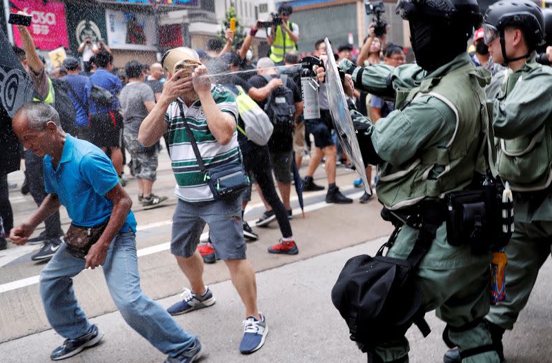 Pictures of the Year: Hong Kong protest tide turns into sea of flames