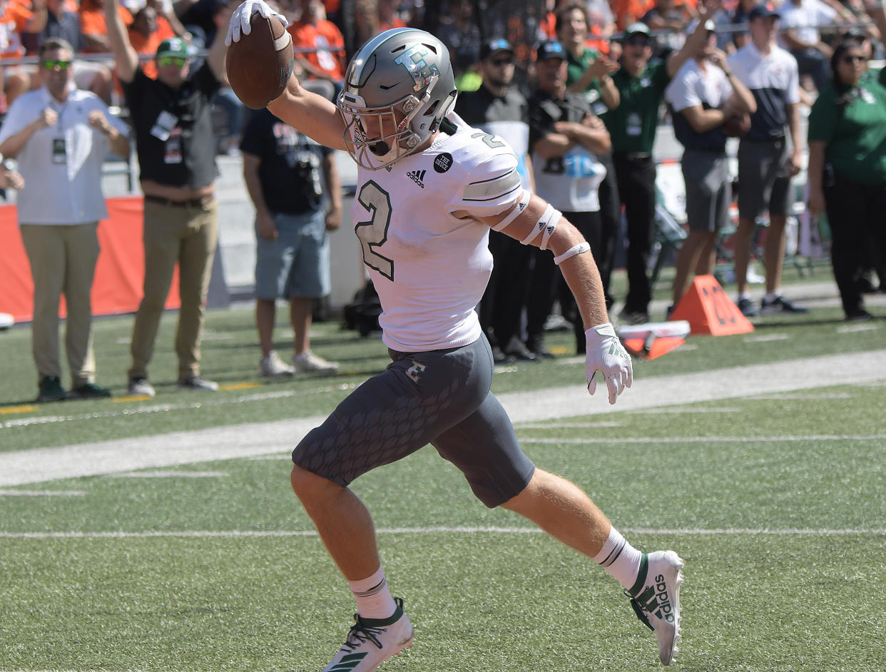 Mathew Sexton blocked a punt and returned it for a touchdown in the final seconds to send Eastern Michigan past Central Connecticut State on Saturday.