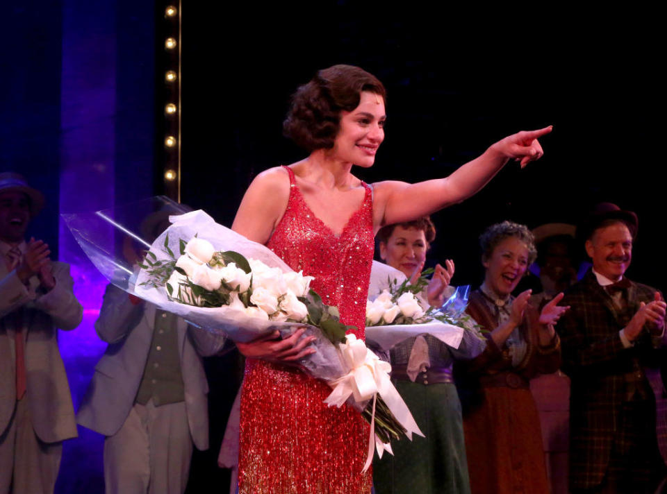 lea on a broadway stage with flowers