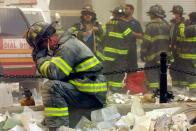 <p>A firefighter breaks down in the wreckage of the World Trade Center following a terrorist attack.</p>