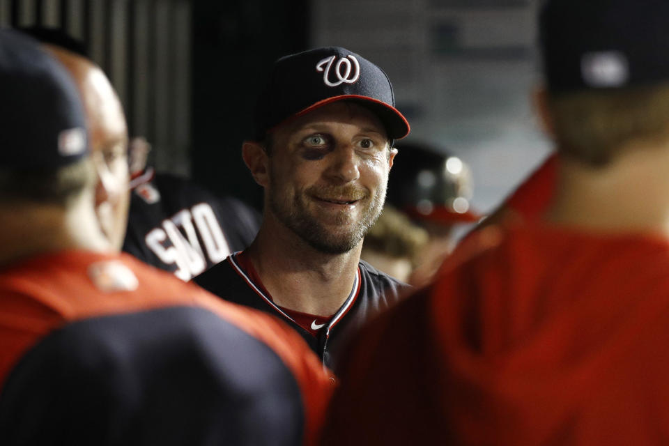 Washington Nationals starting pitcher Max Scherzer walks in the dugout in the seventh inning of the second baseball game of a doubleheader against the Philadelphia Phillies, Wednesday, June 19, 2019, in Washington. Washington won 2-0. (AP Photo/Patrick Semansky)