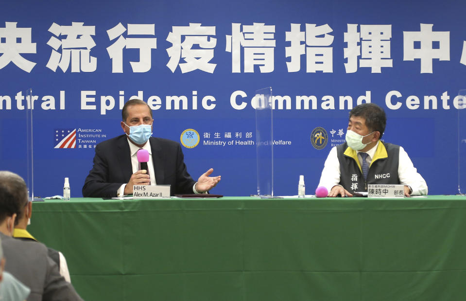 U.S. Health and Human Services Secretary Alex Azar, left, and Taiwanese Minister of Health and Welfare Chen Shih-chung answer questions from media after the signing ceremony for a memorandum of understanding at the Central Epidemic Command Center in Taipei, Taiwan, Monday, Aug. 10, 2020. Azar arrived in Taiwan on Sunday in the highest-level visit by an American Cabinet official since the break in formal diplomatic relations between Washington and Taipei in 1979. (AP Photo/Chiang Ying-ying)