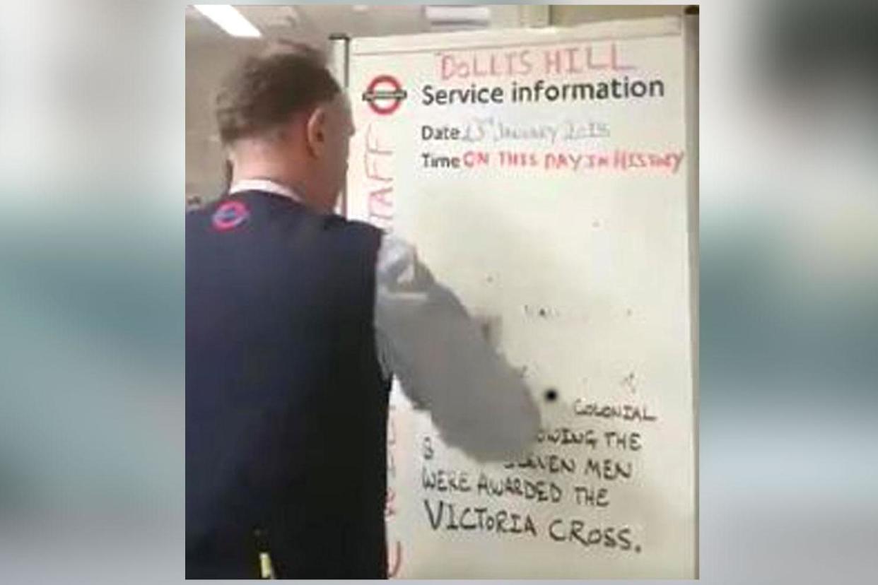 A still image taken from footage of TfL worker removing a 'controversial' message from a Tube station notice board: @lilyallen