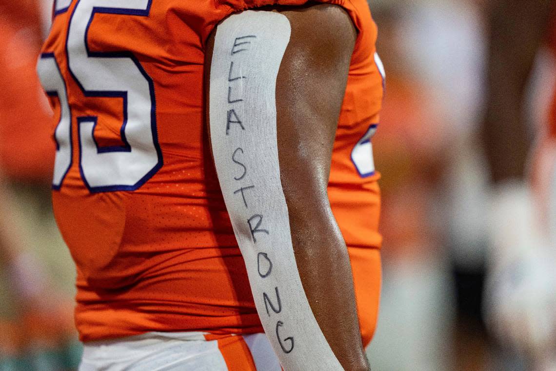 Clemson defensive tackle Payton Page honors Ella Bresee, sister of defensive tackle Bryan Bresee, during the team’s NCAA college football game against Louisiana Tech on Saturday, Sept. 17, 2022, in Clemson, S.C. Ella Bresee died recently of brain cancer. (AP Photo/Jacob Kupferman)