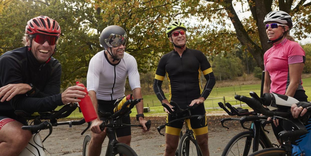 cyclists relaxing on roadside