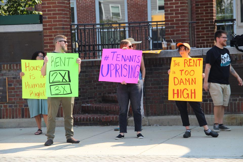 Protesters stand in solidarity against rent hikes in downtown Newmarket on Saturday, Sept. 10.