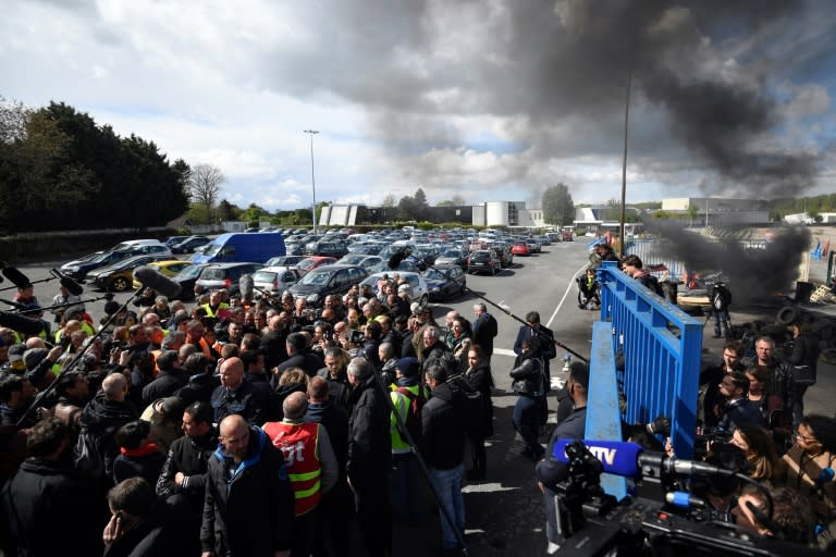 Tyres were burning as Emmanuel Macron made his visit