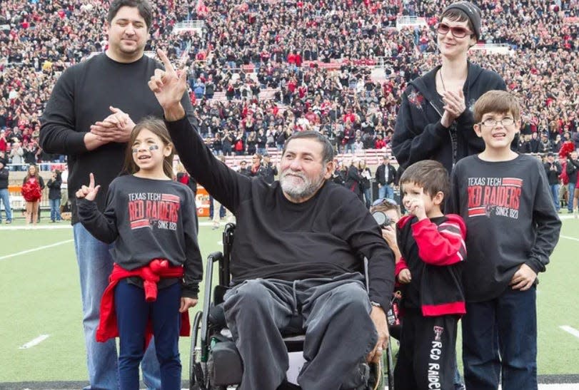 Gabe Rivera, a former defensive tackle for the Texas Tech Red Raiders, is pictured with family during his induction into the Texas Tech Ring of Honor.