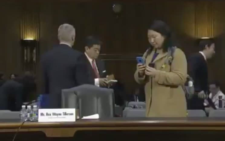 A reporter taking photos of Secretary of State-designate Rex Tillerson notes on Capitol Hill in Washington, Jan. 11, 2017, at his confirmation hearing before the Senate Foreign Relations Committee. (Photo: Periscope)