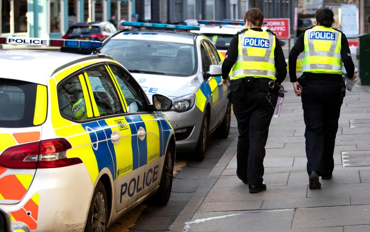 Police officers outside the Police Scotland Leith station in Edinburgh