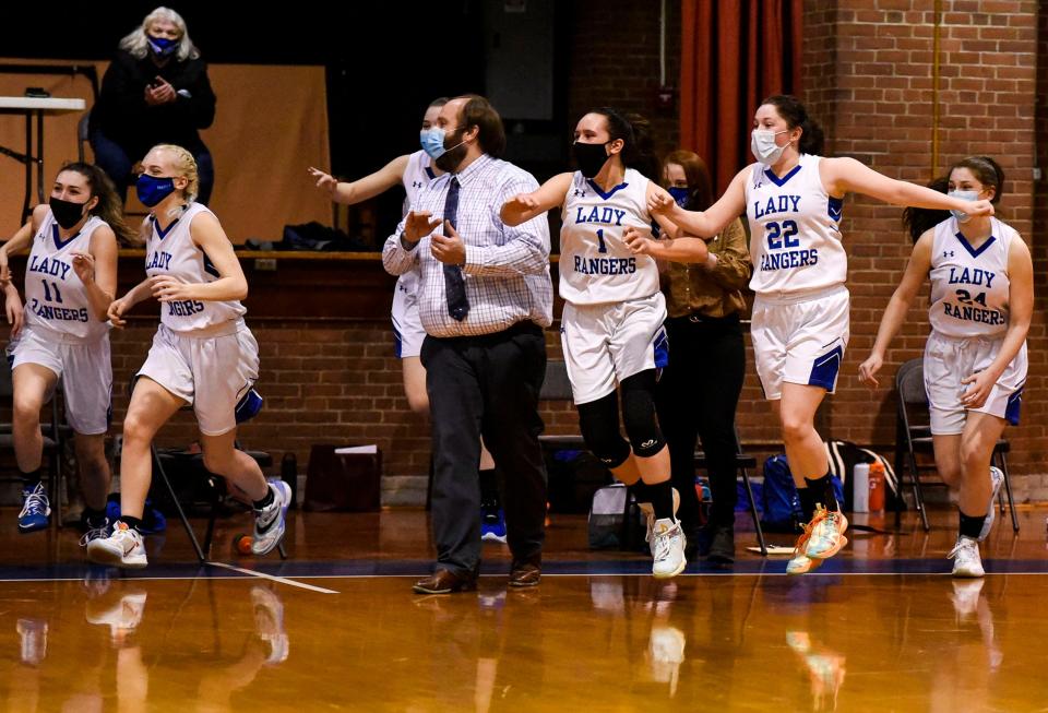 Sakoya Sweeney (1), Tia Martinez (22) and the Lake Region Rangers react at the final buzzer of their 53-37 win over No. 3 Vergennes in the Division III championship at Barre Auditorium on Saturday, March 27, 2021.