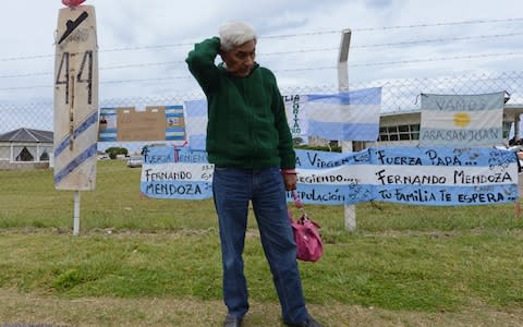 Juan Carlos Mendoza, father of Fernando Mendoza, a crew member of the missing submarine ARA San Juan, stands outside the Navel base in Mar del Plata, Argentina waiting for news - Credit: AP
