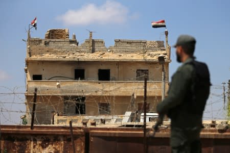 Member of Palestinian security forces, loyal to Hamas, stands guard at the border area with Egypt, in the southern Gaza Strip