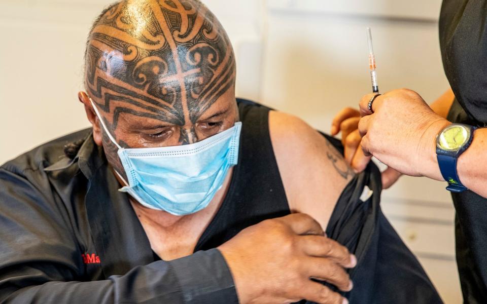 Rangi McLean receives his vaccine at the Manurewa Marae vaccination centre in south Auckland - New Zealand Herald