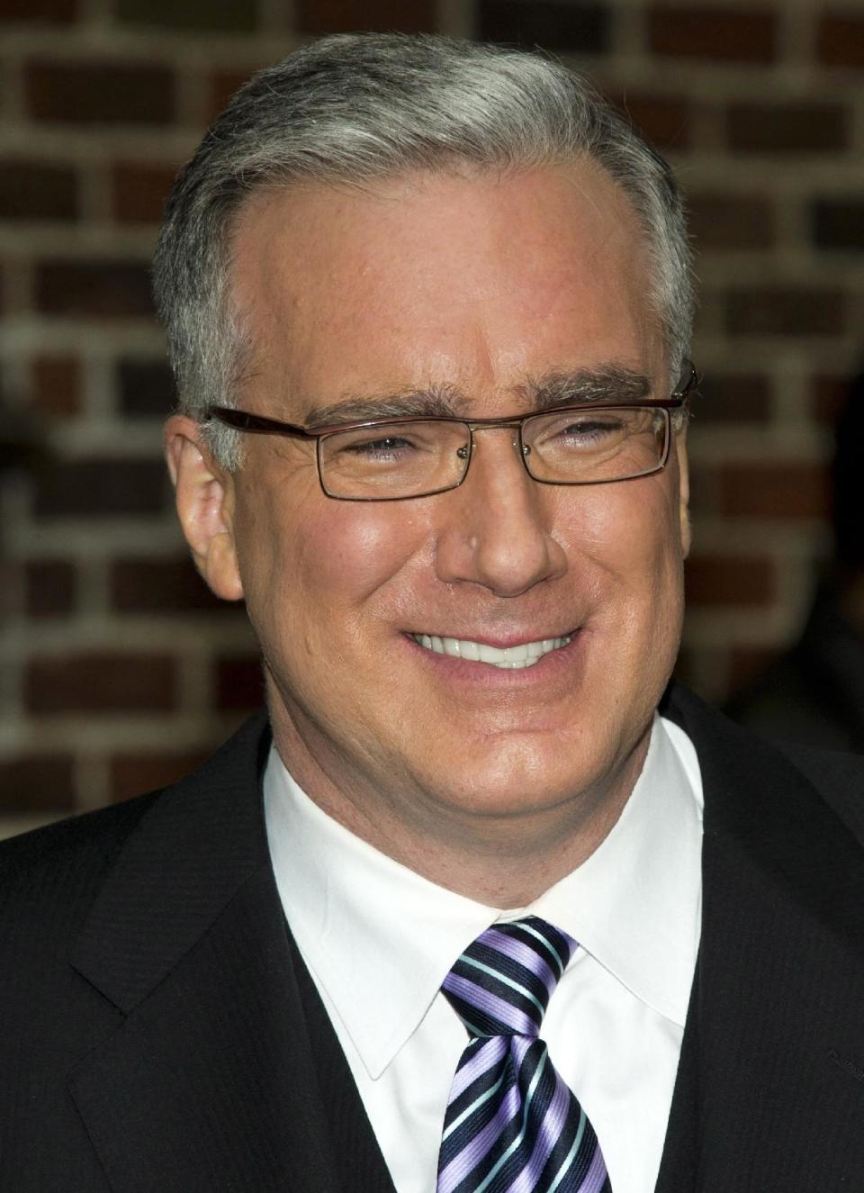 FILE - In this Oct. 24, 2011 file photo, political pundit Keith Olbermann leaves a taping of the "Late Show with David Letterman," in New York. Olbermann sued his former bosses at Current TV in Los Angeles on Thursday, seeking more than $50 million for breach of contract and other claims. His case claims his show for the network was fraught with technical problems and he was fired without cause. (AP Photo/Charles Sykes, file)