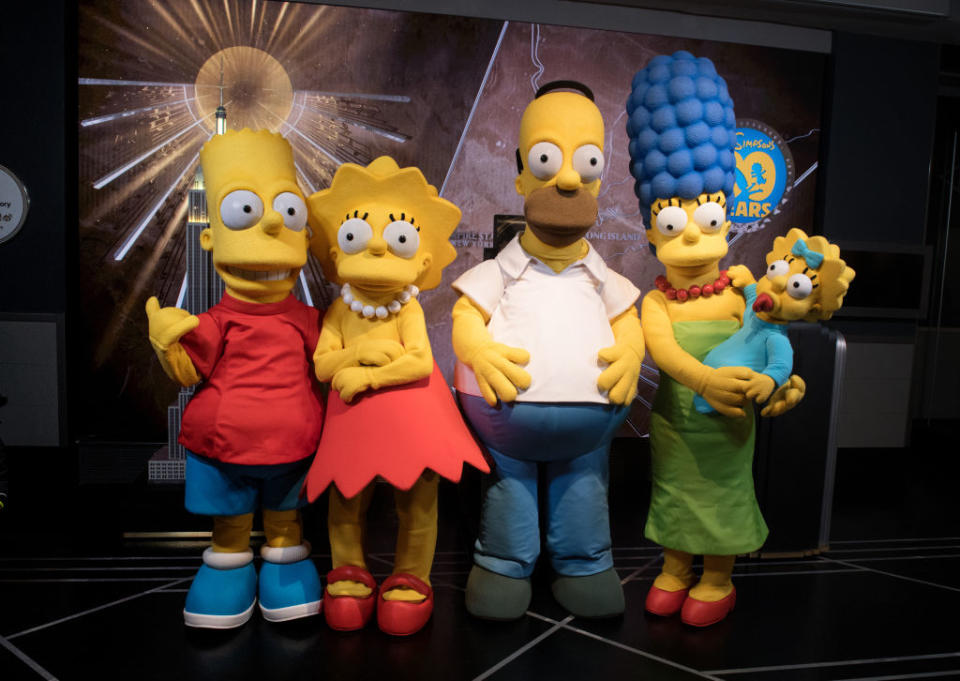 NEW YORK, NY - DECEMBER 17:  (L-R) Bart Simpson, Lisa Simpson, Homer Simpson, Marge Simpson and Maggie Simpson visit The Empire State Building to celebrate the 30th anniversary of 