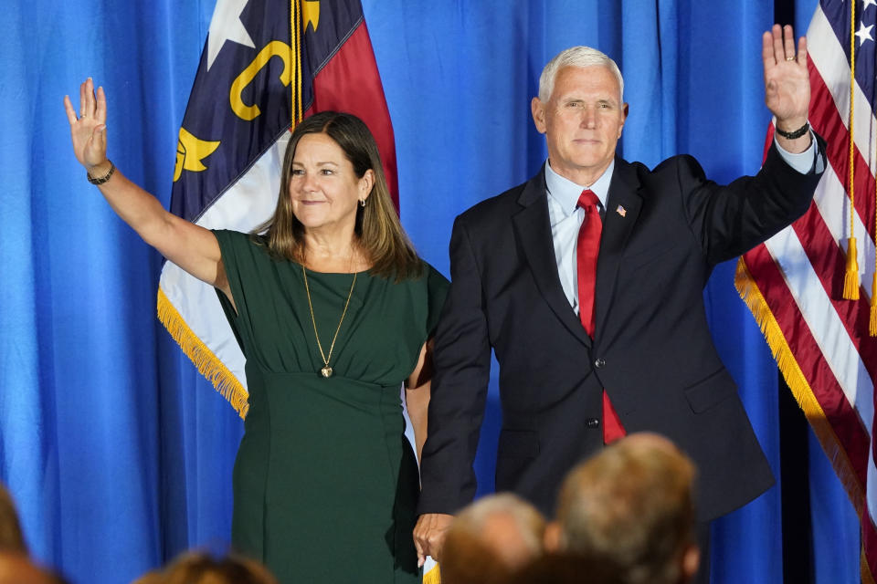 FILE - Republican presidential candidate former Vice President Mike Pence waves on stage with his wife Karen after he spoke during the North Carolina Republican Party Convention in Greensboro, N.C., June 10, 2023. Pence is leaning in on his anti-abortion stance as he campaigns for the Republican presidential nomination. Pence says he does not support exceptions in the case of nonviable pregnancies, when doctors have determined there is no chance a baby will survive outside the womb.(AP Photo/Chuck Burton, File)
