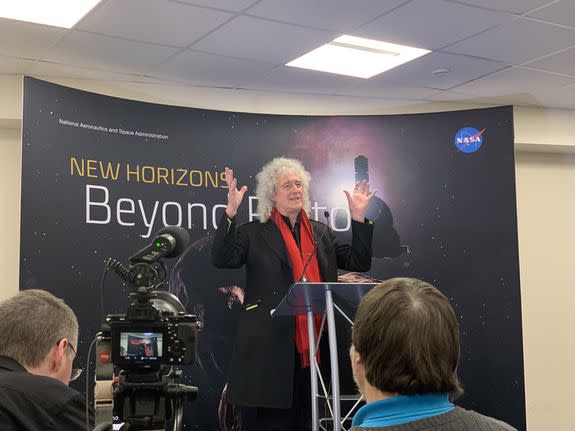 Brian May speaking at the Johns Hopkins Applied Physics Laboratory on Monday.