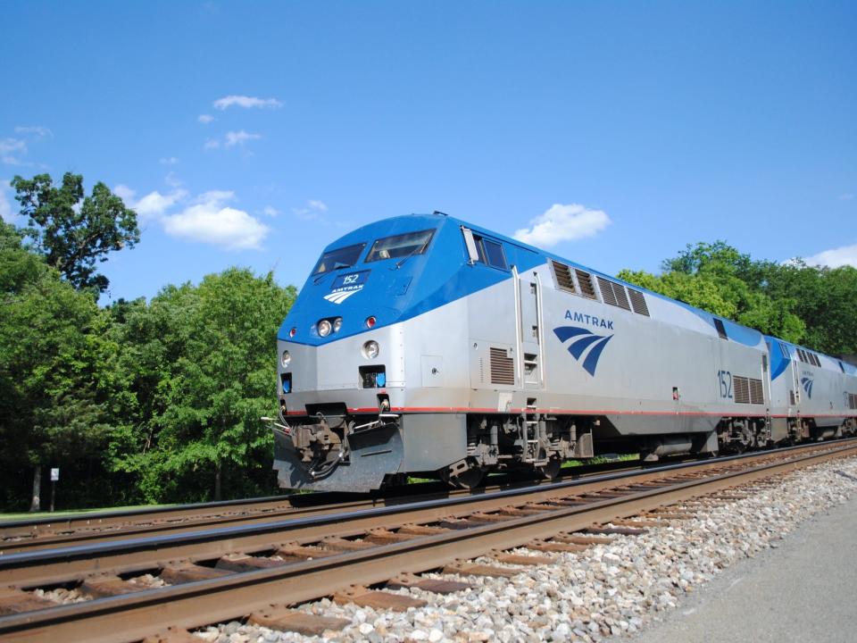 the exterior of an Amtrak long-distance train on the tracks