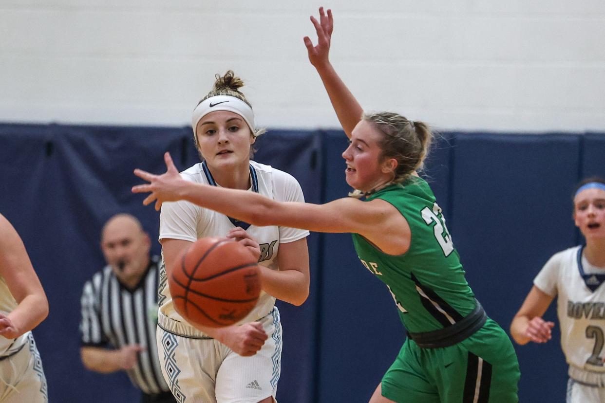 Rootstown's Nadia Lough passes the ball while Mogadore junior Brook McIntyre attempts to deflect it during last year's meeting at the RoverDome.