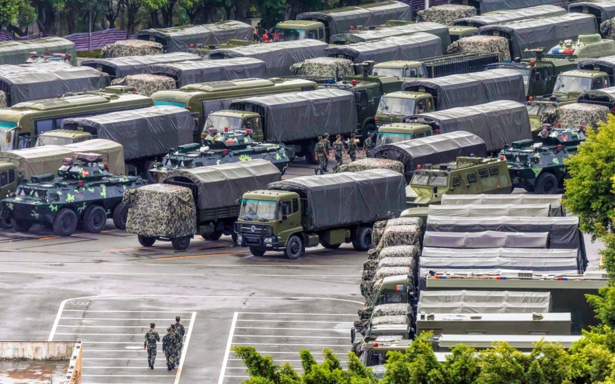 Large numbers of paramilitary police have been deployed to Shenzhen, just across the border from Hong Kong - REX