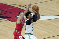 Boston Celtics' Marcus Smart (36) shoots past Chicago Bulls' Zach LaVine during the first half of an NBA basketball game Monday, Jan. 25, 2021, in Chicago. (AP Photo/Charles Rex Arbogast)