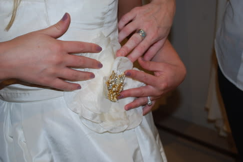 Carrie Bradshaw flower and Miriam Haskell brooch.