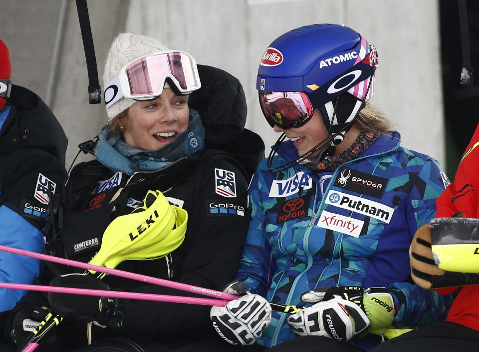 FILE - First-place Mikaela Shiffrin right, of the United States, and her mother, Eileen, smile at the end of a women's World Cup slalom skiing race in Lienz, Austria, Dec. 28, 2017. Eileen is the skiing expert who travels the World Cup circuit — parent, coach, adviser and, as she put it, “shoulder to cry on and vent." (AP Photo/Giovanni Auletta, File)