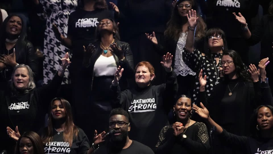 Members of the Lakewood Church choir wear Lakewood Strong shirts during a service Sunday, Feb. 18, 2024, in Houston. Pastor Joel Osteen welcomed worshippers back for the first time since a woman with an AR-style rifle opened fire at his Texas megachurch last Sunday. - David J. Phillip/AP