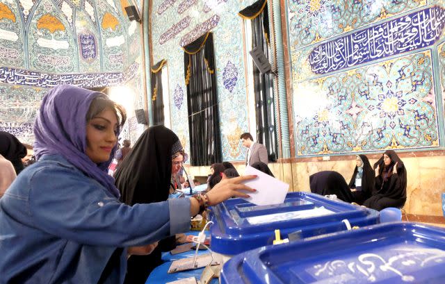An Iranian woman casts her ballot in Tehran.