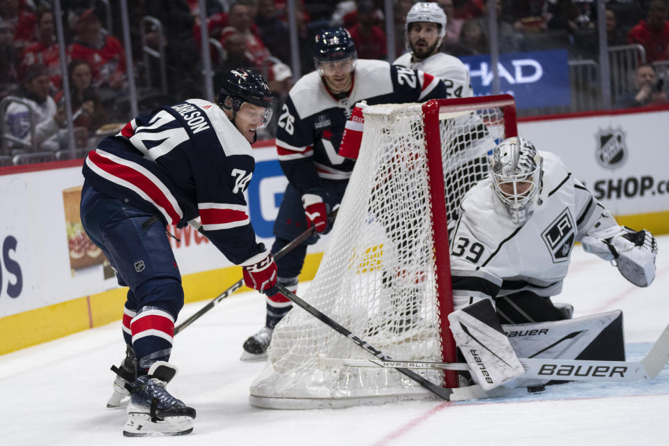 Los Angeles Kings goaltender Cam Talbot (39) blocks a shot by Washington Capitals center Connor McMichael (24) during the first period of an NHL hockey game in Washington, Sunday, Jan. 7, 2024. (AP Photo/Manuel Balce Ceneta)