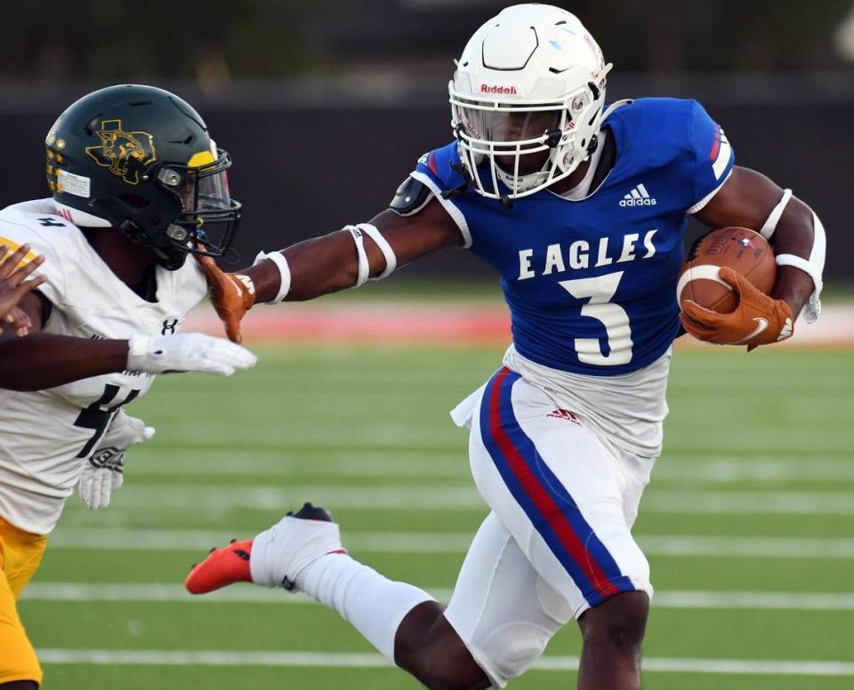 Western Hills’ Cam-Hawkins, left is stiff-armed by Carter-Riverside’s Jameer Muhammad as he runs out of the backfield in the first quarter of Thursday’s September 22, 2022 District 6-4A Division 1 football game at Scarborough Handley Field in Fort Worth, Texas. Special/Bob Haynes