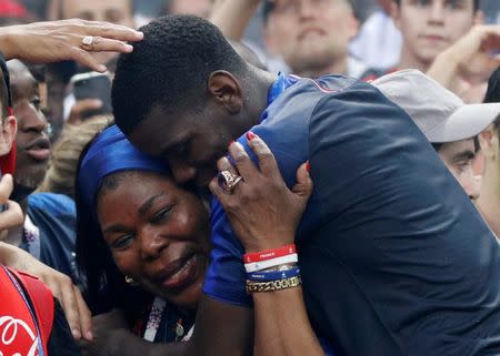 Soccer Football - World Cup - Final - France v Croatia - Luzhniki Stadium, Moscow, Russia - July 15, 2018 France's Paul Pogba celebrates winning the World Cup, with mother Yeo Pogba REUTERS/Darren Staples