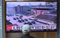 A man watches a television news broadcasting a file footage of a military parade showing North Korean soldiers and weapons, at a railway station in Seoul on October 10, 2020. - Nuclear-armed North Korea was expected to parade its latest and most advanced weapons through the streets of Pyongyang on October 10, as the coronavirus-barricaded country celebrated the 75th anniversary of leader Kim Jong Un's ruling party. (Photo by Jung Yeon-je / AFP) / The erroneous mention[s] appearing in the metadata of this photo by Jung Yeon-je has been modified in AFP systems in the following manner: changes dateline in IPTC metadata field to [Seoul] instead of [Pyongyang]. Please immediately remove the erroneous mention[s] from all your online services and delete it (them) from your servers. If you have been authorized by AFP to distribute it (them) to third parties, please ensure that the same actions are carried out by them. Failure to promptly comply with these instructions will entail liability on your part for any continued or post notification usage. Therefore we thank you very much for all your attention and prompt action. We are sorry for the inconvenience this notification may cause and remain at your disposal for any further information you may require. (Photo by JUNG YEON-JE/AFP via Getty Images)