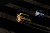 LAS VEGAS, NV - MARCH 10: Sam Hornish Jr., driver of the #12 Alliance Truck Parts Dodge, leads Brendan Gaughan, driver of the #33 South Point Hotel & Casino Chevrolet, and Elliott Sadler, driver of the #2 OneMain Financial Chevrolet, during the NASCAR Nationwide Series Sam's Town 300 at Las Vegas Motor Speedway on March 10, 2012 in Las Vegas, Nevada. (Photo by Ezra Shaw/Getty Images)