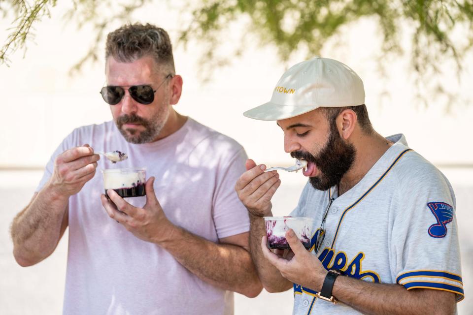 Professional chefs Alex Carter, owner of Black Cat Ice Cream, and Rateb Aburas, executive chef of Mulberry Street Tavern and the Surety Hotel Des Moines, try the Blue Ribbon Cobbler from Iowa Fruit & Vegetable Growers Association at the Iowa State Fair.