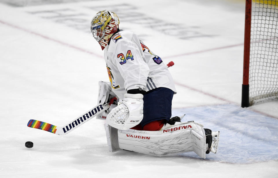 Florida Panthers goaltender Alex Lyon (34) warms up while wearing a Pride Night hockey jersey before playing the Toronto Maple Leafs, Thursday, March 23, 2023, in Sunrise, Fla. (AP Photo/Michael Laughlin)
