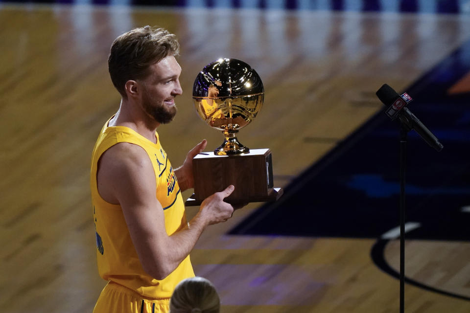 Indiana Pacers forward Domantas Sabonis holds the trophy after winning the skills challenge portion of basketball's NBA All-Star Game in Atlanta, Sunday, March 7, 2021. (AP Photo/Brynn Anderson)