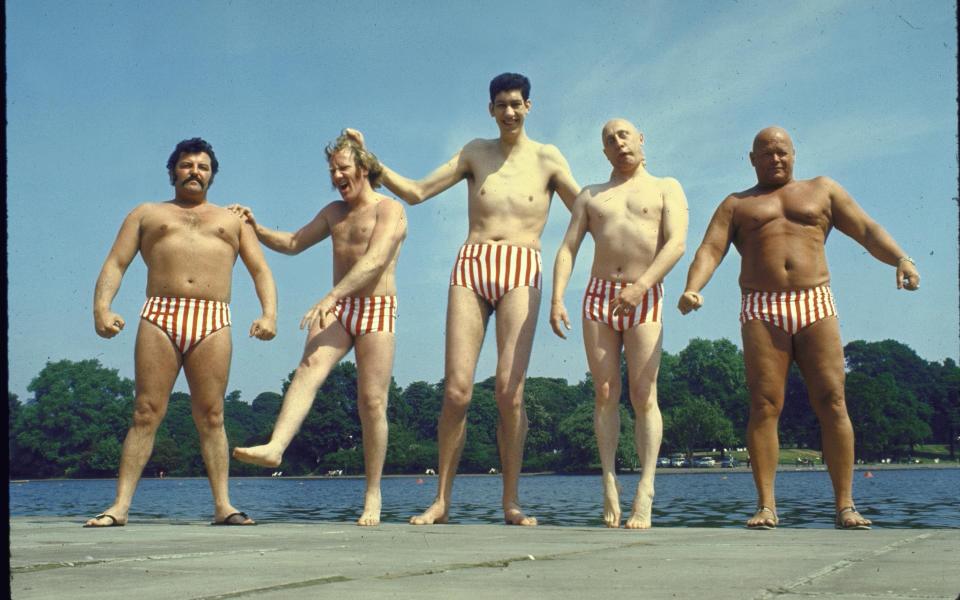 Varied assortment of male models who work for the London agency UGLY posing in striped bathingsuits. (Photo by Loomis Dean/The LIFE Picture Collection via Getty Images) - Getty