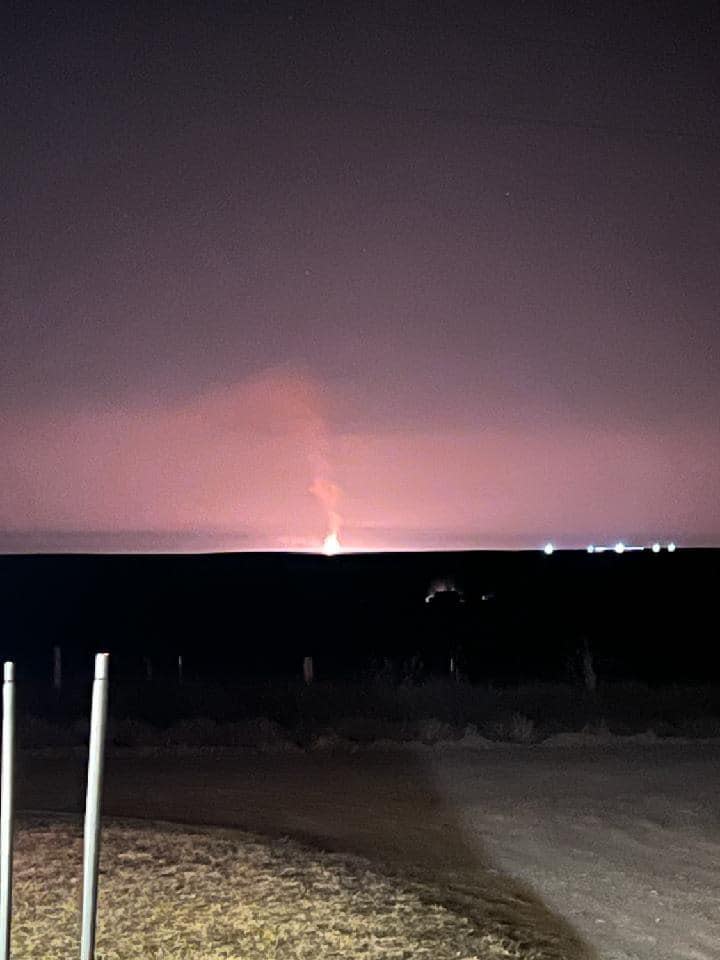 This photo posted to social media by the Elmwood Fire Department in Oklahoma shows a red glow emerging from the site of a gas pipeline explosion.  / Credit: Elmwood Fire Department via Facebook