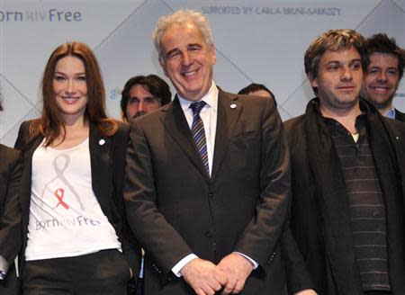 France's then First lady Carla Bruni-Sarkozy (L), professor Michel Kazatchkine (C), Executive Director of the Global Fund to Fight AIDS, Tuberculosis and Malaria, and Julien Civange (R), musician and adviser of Carla Bruni-Sarkozy, attend the International launch of the Born Hiv Free campaign in Paris May 19, 2010. REUTERS/Philippe Wojazer/Files