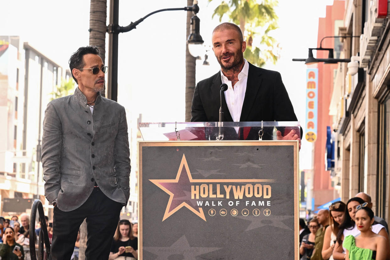 US singer Marc Anthony (L) is presented a star by Inter Miami's co-owner David Beckham on the Hollywood Walk of Fame during a ceremony in Hollywood, California on September 7, 2023.  (Patrick T. Fallon / AFP via Getty Images)