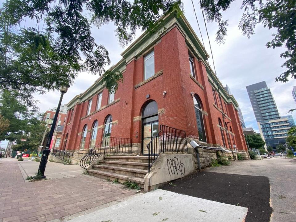 The post office on 1117 Queen Street West had its doors open for more than a century until Canada Post closed the site in 2020. The building was privately sold in late 2021 against community member and the city's requests to look into transforming it into a communal and arts hub instead. (Paul Borkwood/CBC - image credit)