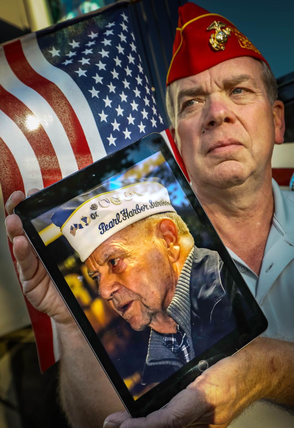 Dale Edge, son of Jack Edge, a Pearl Harbor survivor, holds a picture of his late father on Tuesday. Jack Edge died on Nov. 28, 2021 at the age of 97. "He enlisted at 17 years of age in 1941 and served 20 years," Dale said Tuesday afternoon. "His shoes will be hard to fill. He always said never forget about Pearl Harbor."