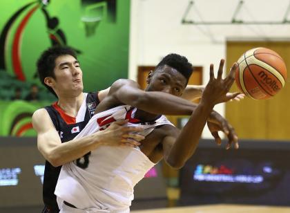 Harry Giles of the United States competes for the ball with Gen Hiraiwa of Japan (Photo by Francois Nel/Getty Images)