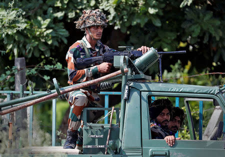 Soldiers patrol the streets in Panchkula, India August 26, 2017. REUTERS/Cathal McNaughton