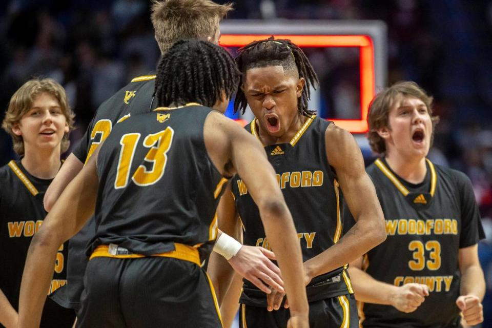 Woodford County players celebrate in front of a large contingent of Yellow Jackets fans after defeating Jeffersontown in the opening game of the Boys’ Sweet 16 in Rupp Arena on Wednesday. Woodford County is playing in its first state tournament since 1986.