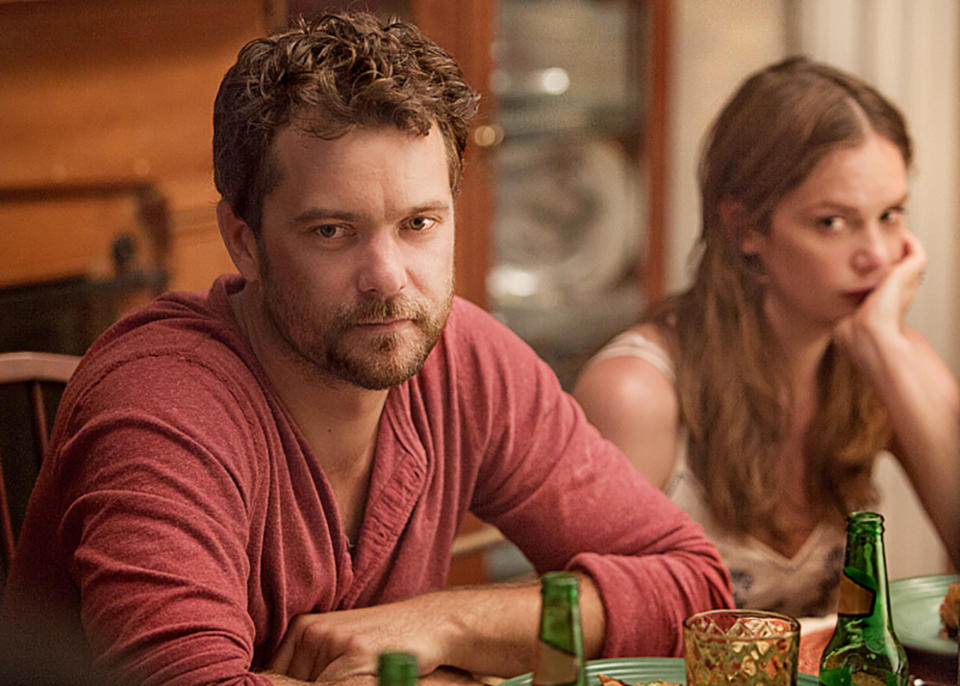 Joshua and Ruth sitting at a table in a scene from The Affair