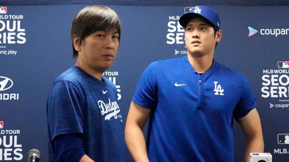 Ippei Mizuhara, left, the then-interpreter for Los Angeles Dodgers star Shohei Ohtani, right, leave a news conference on March 16. Mizuhara was later fired amid allegations of illegal gambling. - Lee Jin-man/AP