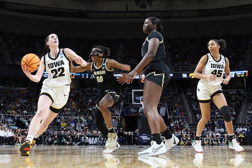 ALBANY, NEW YORK - MARCH 30: Caitlin Clark #22 of the Iowa Hawkeyes drives against Jaylyn Sherrod #0 of the Colorado Buffaloes during the second half in the Sweet 16 round of the NCAA Women's Basketball Tournament at MVP Arena on March 30, 2024 in Albany, New York. The Iowa Hawkeyes won, 89-68. (Photo by Sarah Stier/Getty Images)